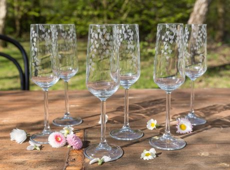 a group of wine glasses on a table