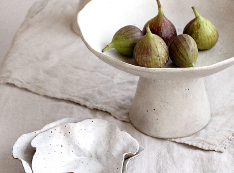 a bowl of figs on a table