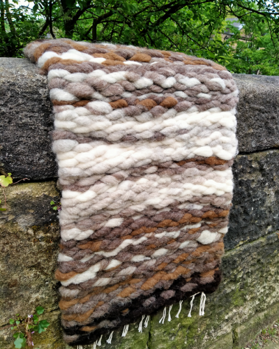Pebble rug on wall